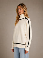 Women's Oversized Roll Neck Jumper – Soft Knit Style in Cream – Side view