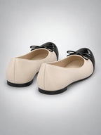 Women's Cap-Toe Ballet Flats – Bow Detail in Beige — back view