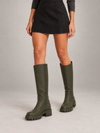 Women's Lug-Sole Knee-High Boots – Round Toe in Dark Olive — on model