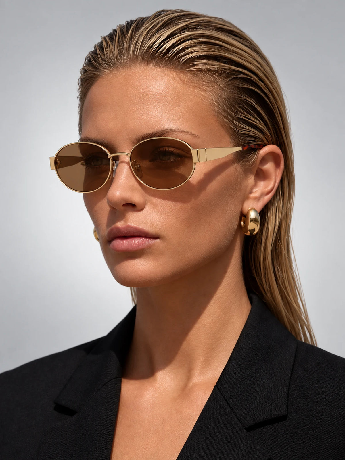 Women's Metal Oval Sunglasses – Wide Temple Detail in Gold/Brown — on model