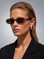 Women's Small Oval Sunglasses – Retro Frame in Tortoiseshell — on model